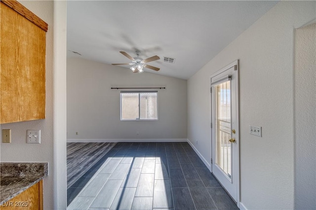 spare room with ceiling fan and lofted ceiling