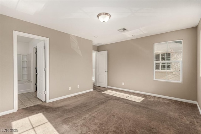 empty room featuring carpet flooring