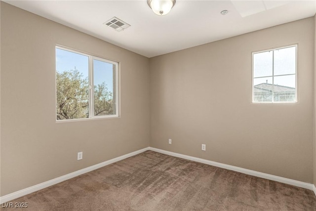 carpeted empty room featuring a healthy amount of sunlight