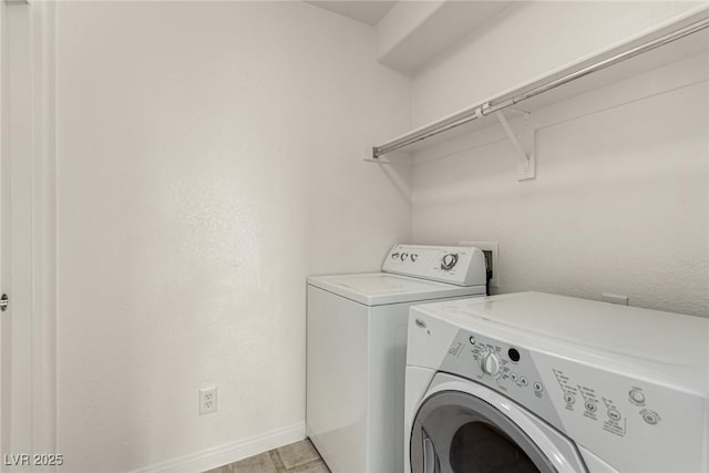 washroom featuring washing machine and dryer