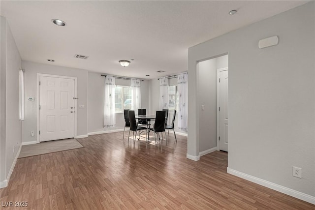 unfurnished dining area with hardwood / wood-style flooring