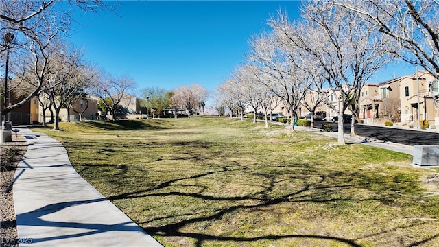 view of home's community featuring a yard