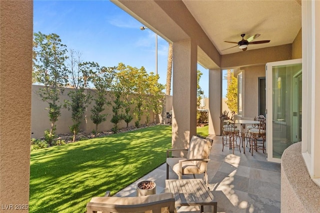 view of patio / terrace featuring ceiling fan