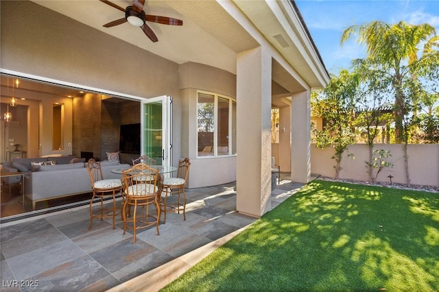 view of patio / terrace featuring ceiling fan