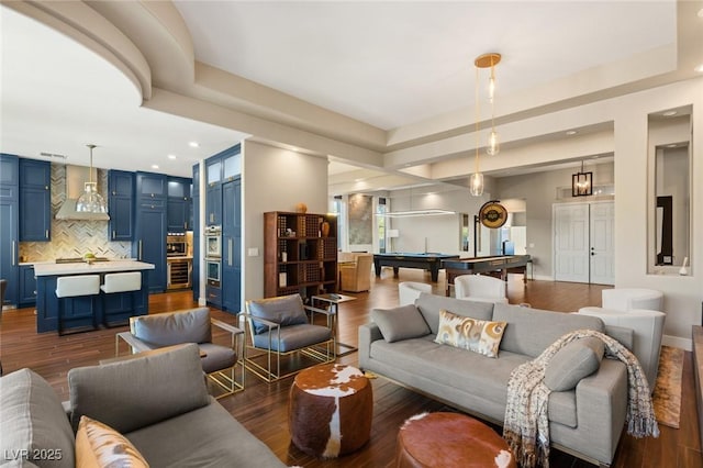 living room with dark wood-type flooring and pool table