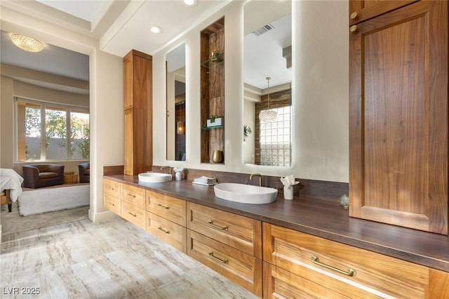 bathroom featuring vanity and hardwood / wood-style flooring