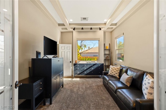 living room featuring dark carpet, beamed ceiling, and coffered ceiling