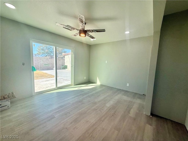 unfurnished room with ceiling fan, wood finished floors, and recessed lighting