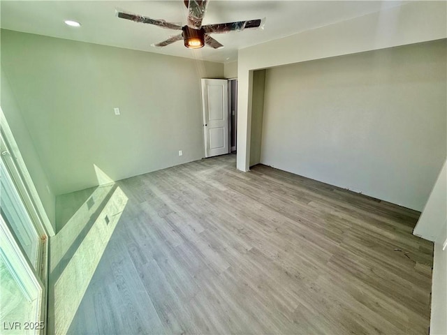 unfurnished bedroom featuring ceiling fan and wood finished floors