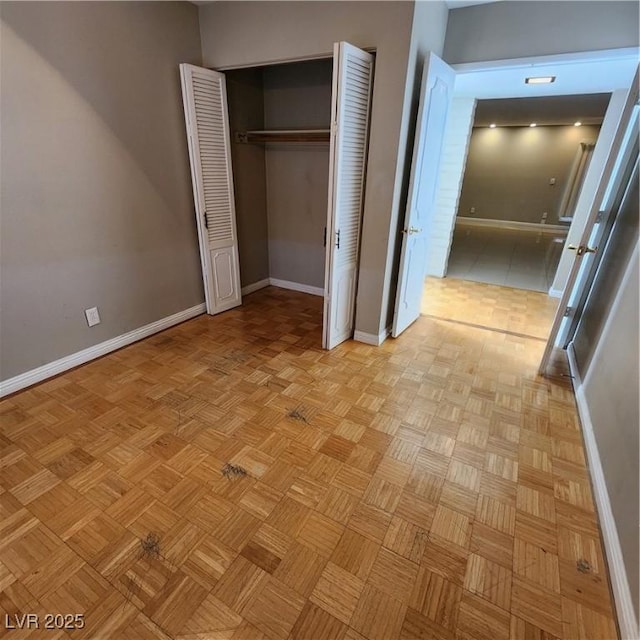 unfurnished bedroom featuring light parquet flooring