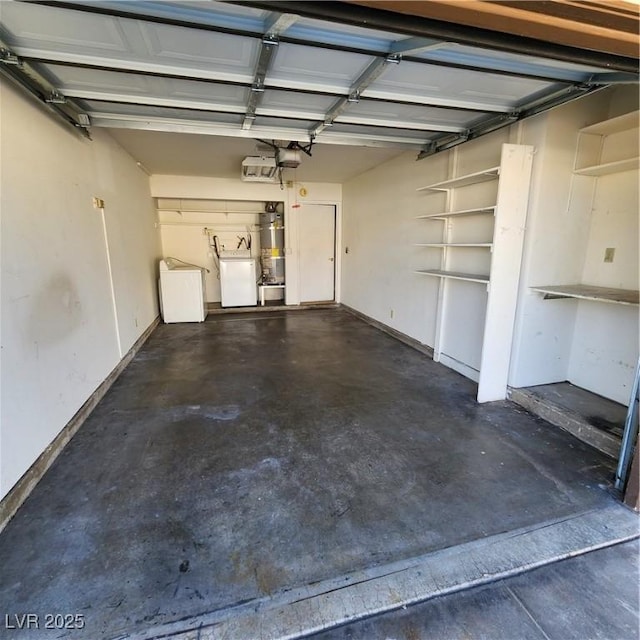 garage featuring separate washer and dryer and a garage door opener