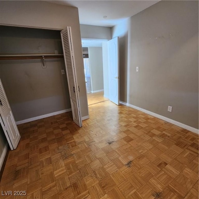 unfurnished bedroom with light parquet floors