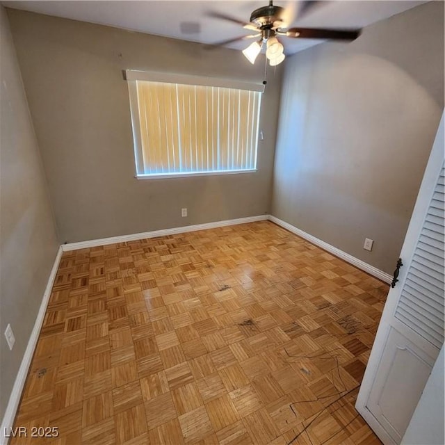 unfurnished room featuring ceiling fan and light parquet flooring