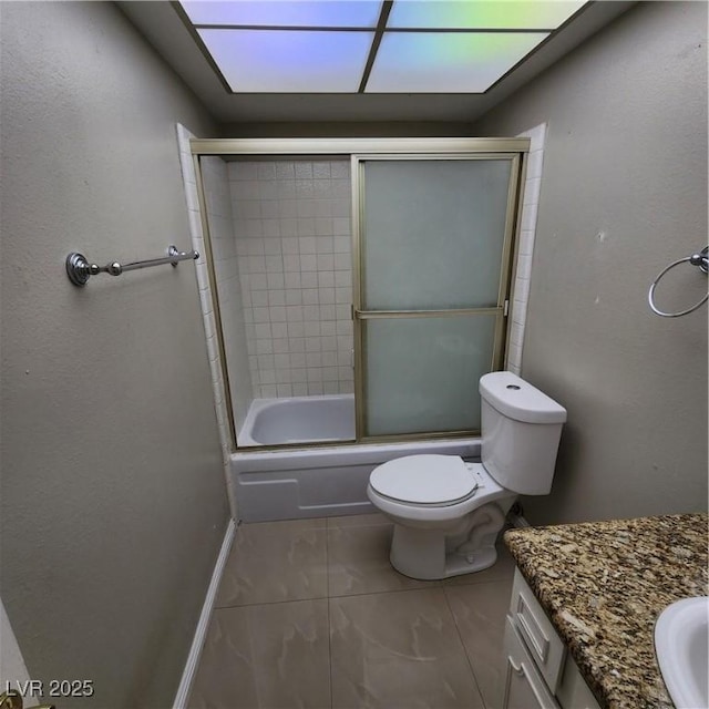 full bathroom featuring enclosed tub / shower combo, vanity, toilet, and tile patterned flooring