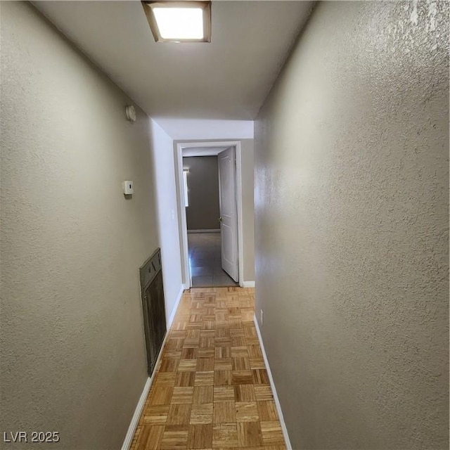 hallway with light parquet floors