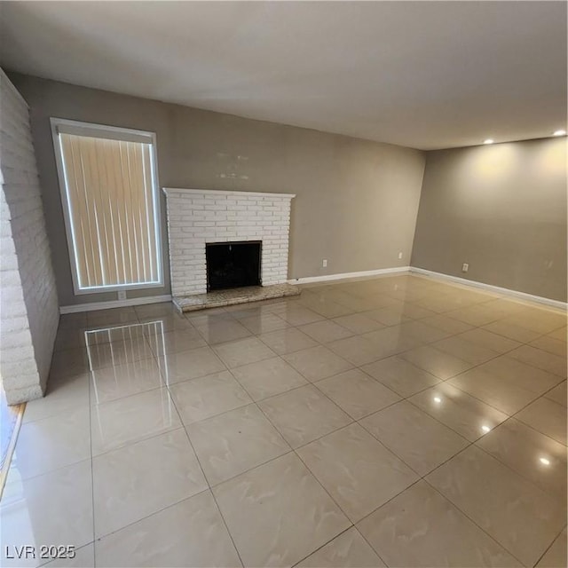 unfurnished living room with light tile patterned flooring and a fireplace