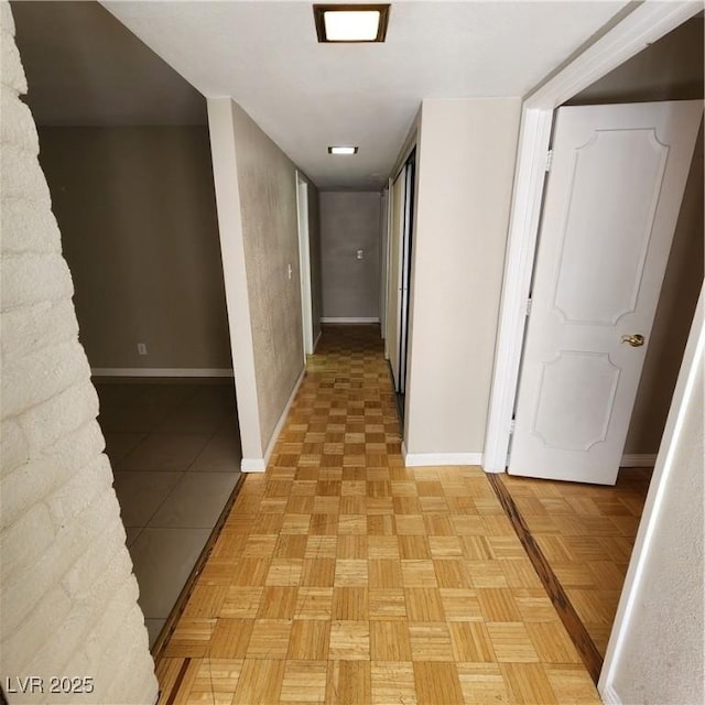 corridor with light parquet flooring