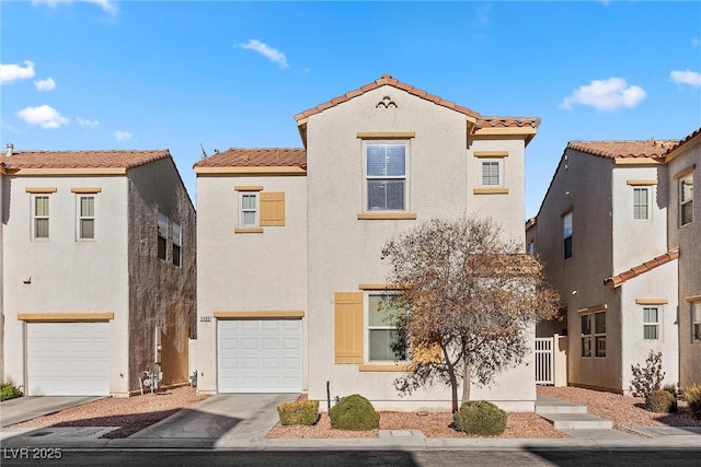 mediterranean / spanish home featuring a garage