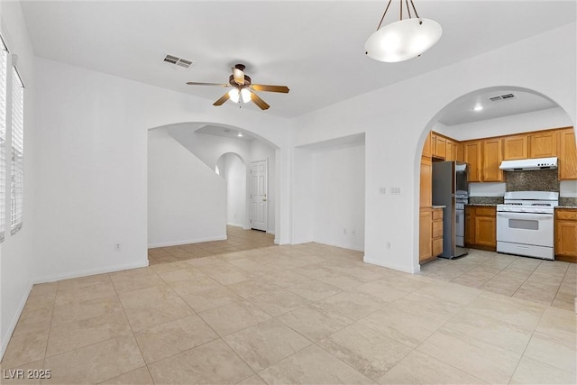 kitchen with stainless steel fridge, hanging light fixtures, white range, ceiling fan, and light tile patterned flooring