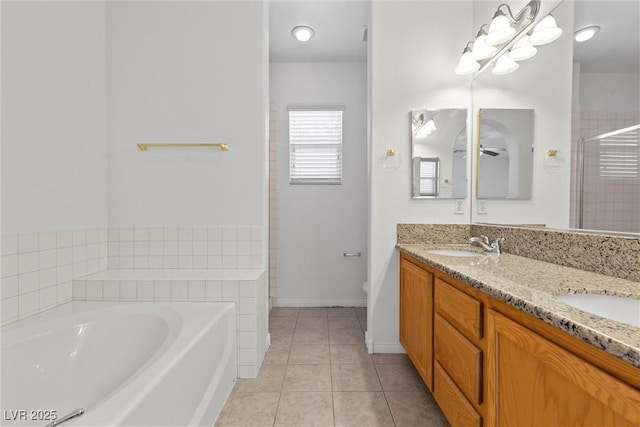 bathroom featuring tile patterned flooring, shower with separate bathtub, ceiling fan, and vanity