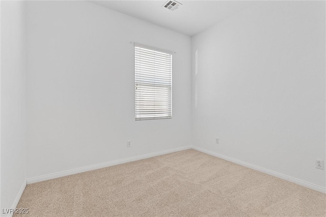 empty room featuring light colored carpet