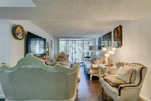 living room with hardwood / wood-style flooring, a textured ceiling, and floor to ceiling windows