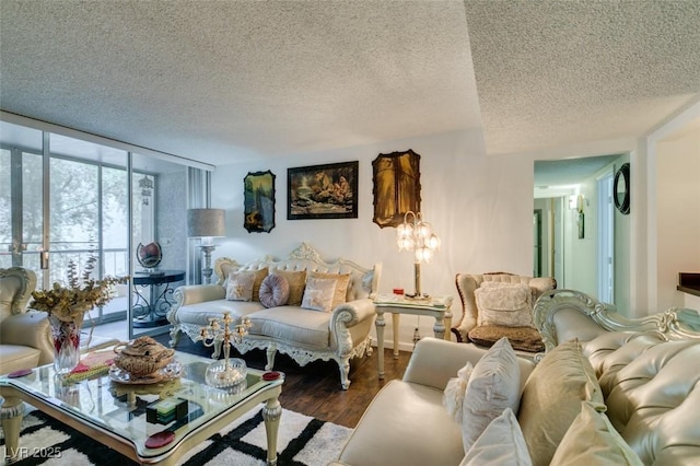 living room featuring wood-type flooring, expansive windows, and a textured ceiling