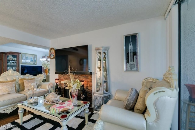 living room with wood-type flooring and a textured ceiling