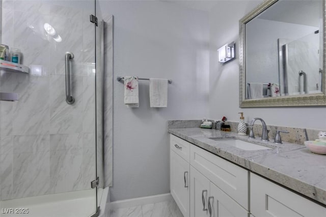 bathroom featuring vanity and a shower with door