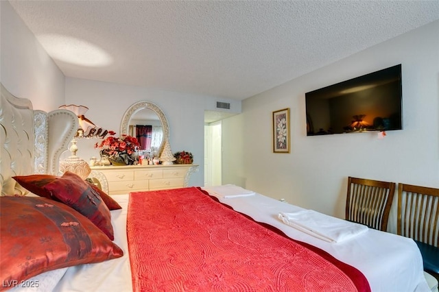 bedroom featuring a textured ceiling