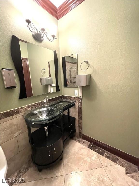 bathroom with vanity, tile patterned floors, and ornamental molding