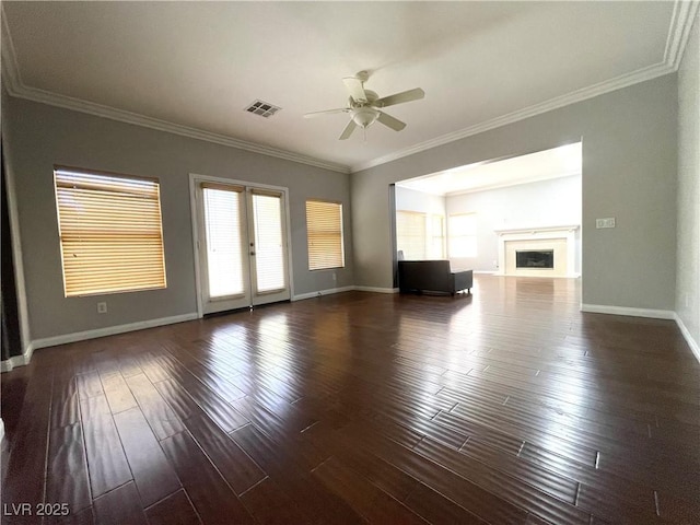 unfurnished living room featuring ornamental molding, ceiling fan, and dark hardwood / wood-style flooring