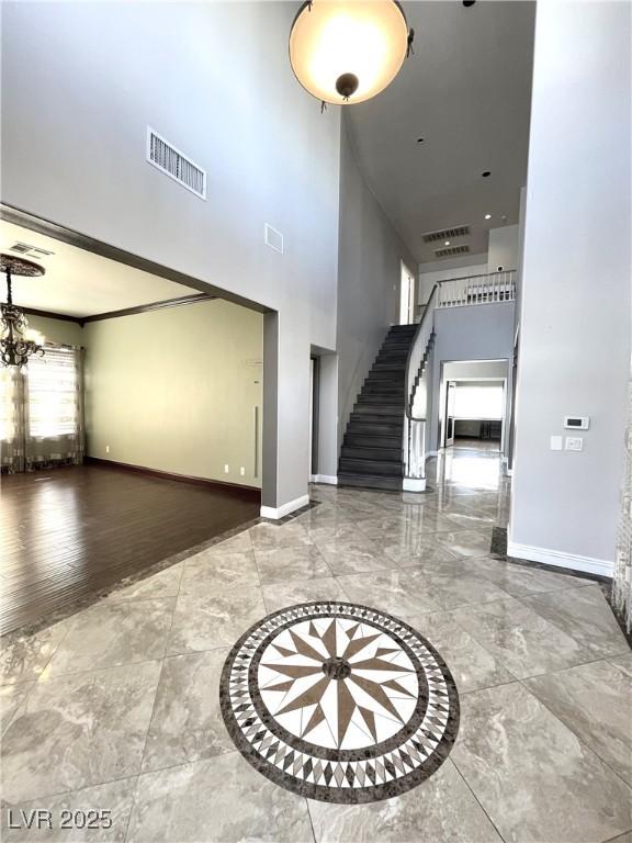 foyer entrance with an inviting chandelier