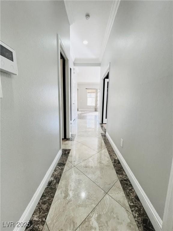 hallway featuring crown molding