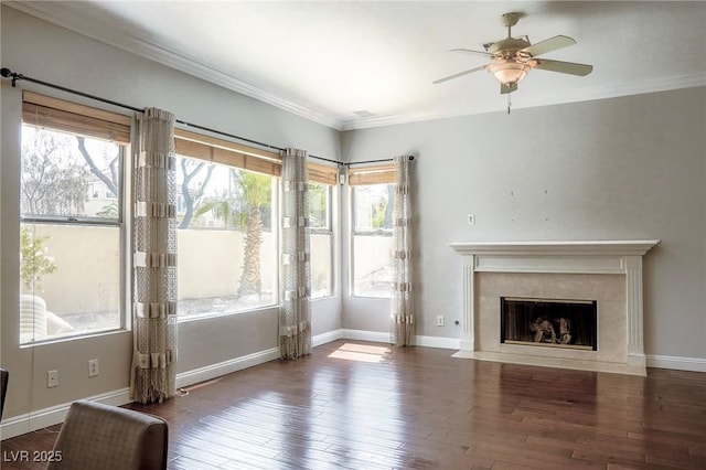 unfurnished living room with a premium fireplace, crown molding, and wood-type flooring