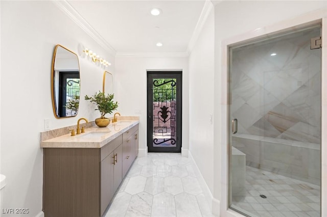 bathroom featuring crown molding, a shower with shower door, and vanity