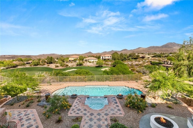 view of swimming pool with a mountain view