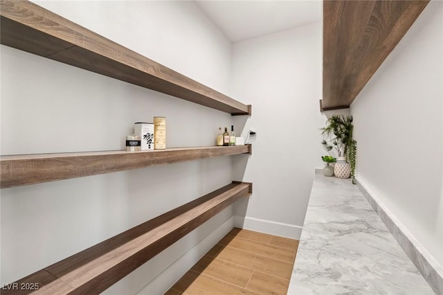 bar with light hardwood / wood-style flooring