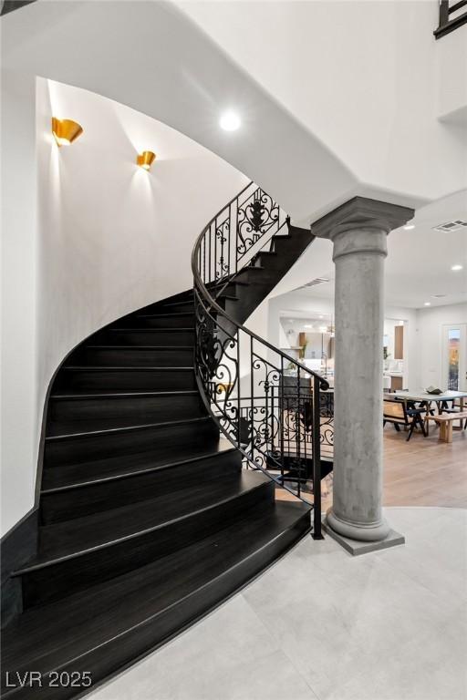 stairway with decorative columns