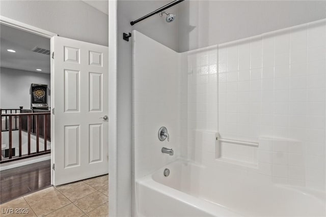 bathroom with bathtub / shower combination and tile patterned floors