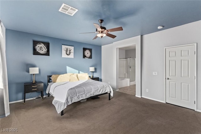 bedroom featuring ceiling fan, ensuite bathroom, and dark colored carpet