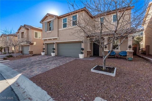 townhome / multi-family property featuring a garage