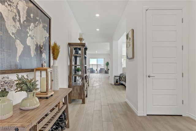 hall with light hardwood / wood-style flooring