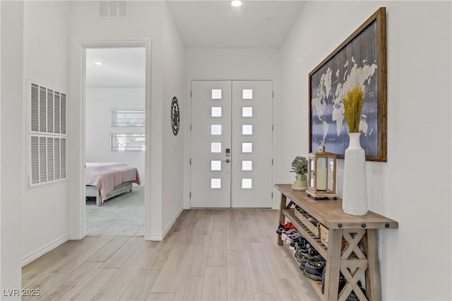 foyer with light wood-type flooring