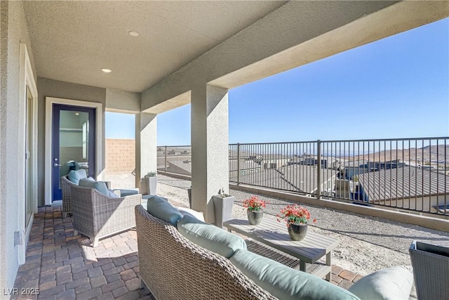 view of patio / terrace featuring an outdoor living space and a balcony