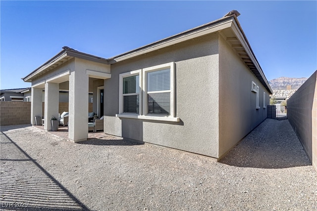 back of property with a patio