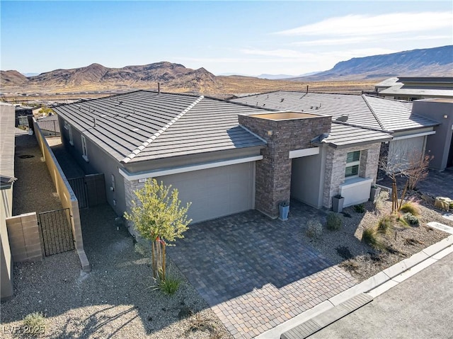 ranch-style house featuring a mountain view and a garage