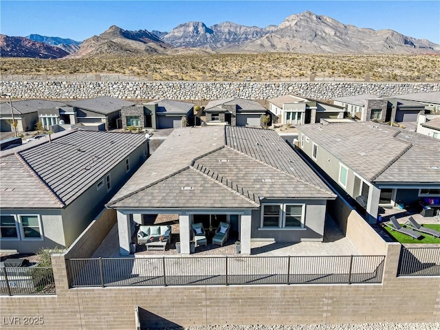 exterior space featuring a mountain view and a patio area