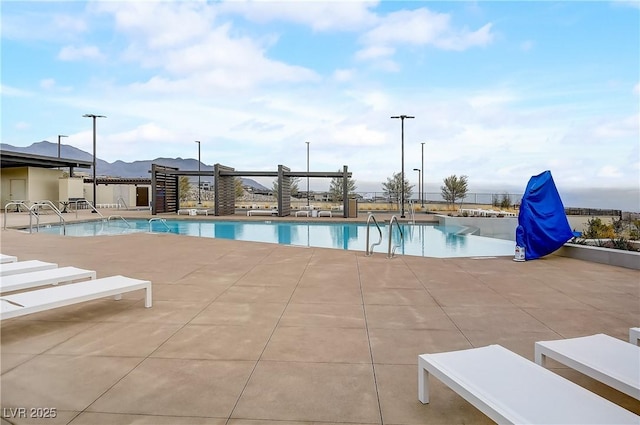 view of pool featuring a patio area