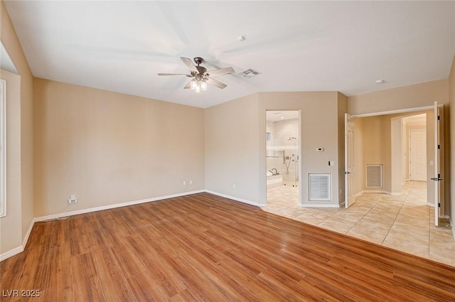 unfurnished living room with ceiling fan and light hardwood / wood-style floors